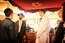 Chazan Braun singing at a chuppah